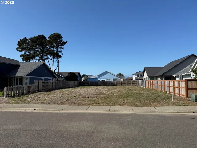 a view of a house with a snow on the road