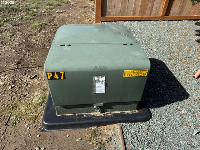 a view of water heater and refrigerator