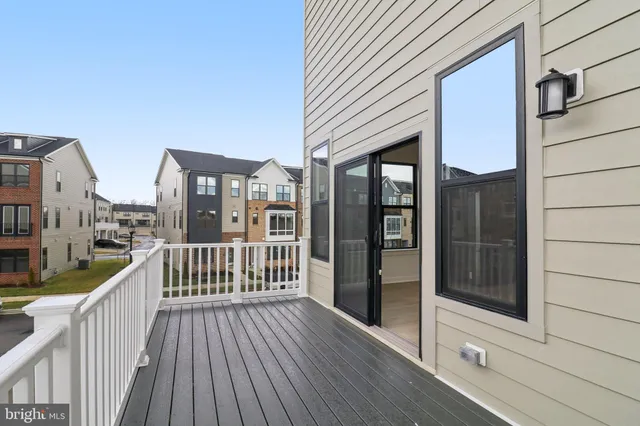 a view of a brick house with large windows