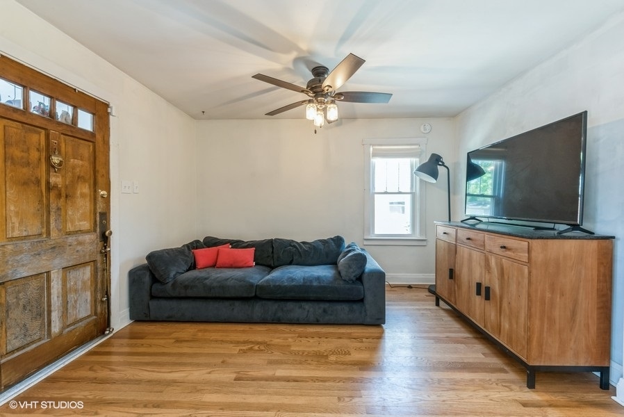 1112 Potter Road Park Ridge, IL 60068 - Photo 5 of 12 a living room with furniture and a flat screen tv