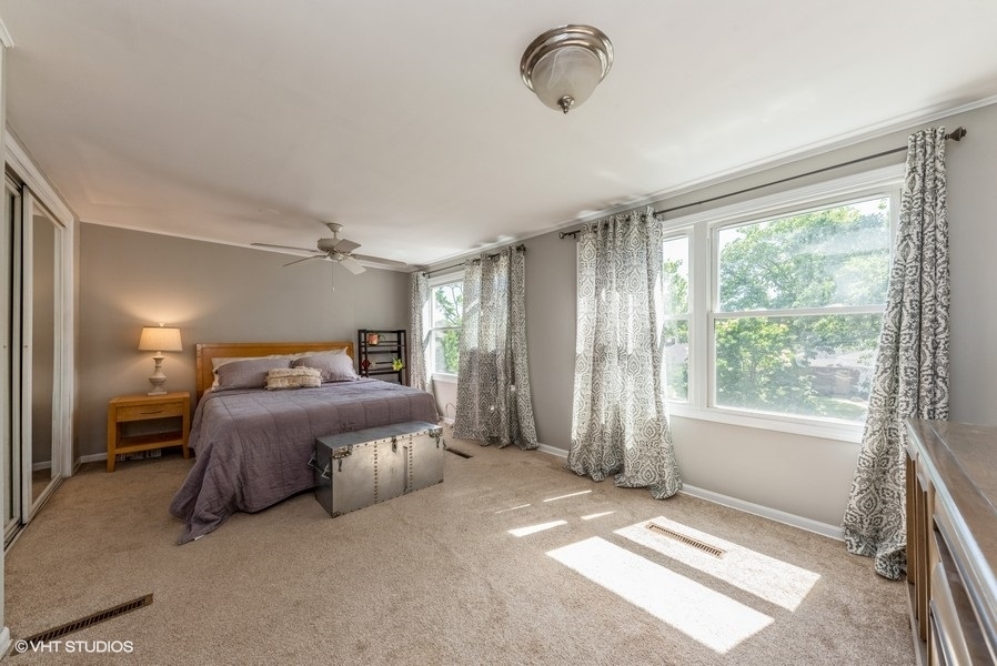 1112 Potter Road Park Ridge, IL 60068 - Photo 7 of 12 a spacious bedroom with a bed and a window