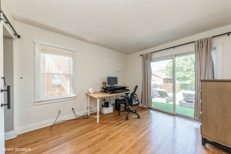 1112 Potter Road Park Ridge, IL 60068 - Photo 8 of 12 a workspace with wooden floor and a window