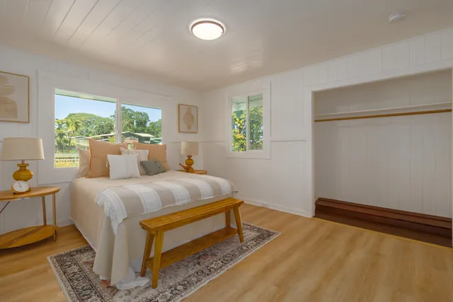 a bedroom with a bed and window