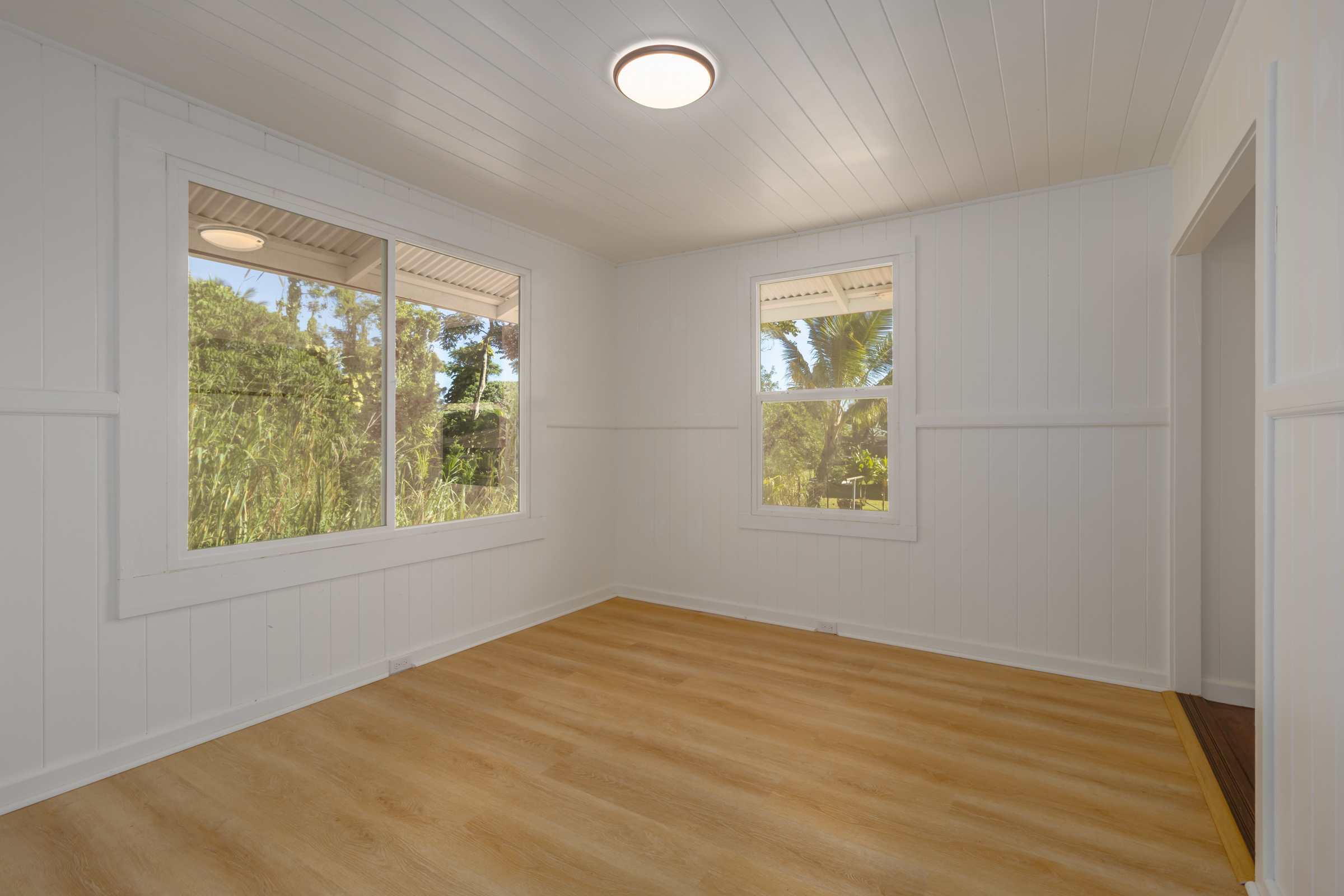 75 East Palai Street Hilo, HI 96720 - Photo 15 of 29 wooden floor in an empty room with a window