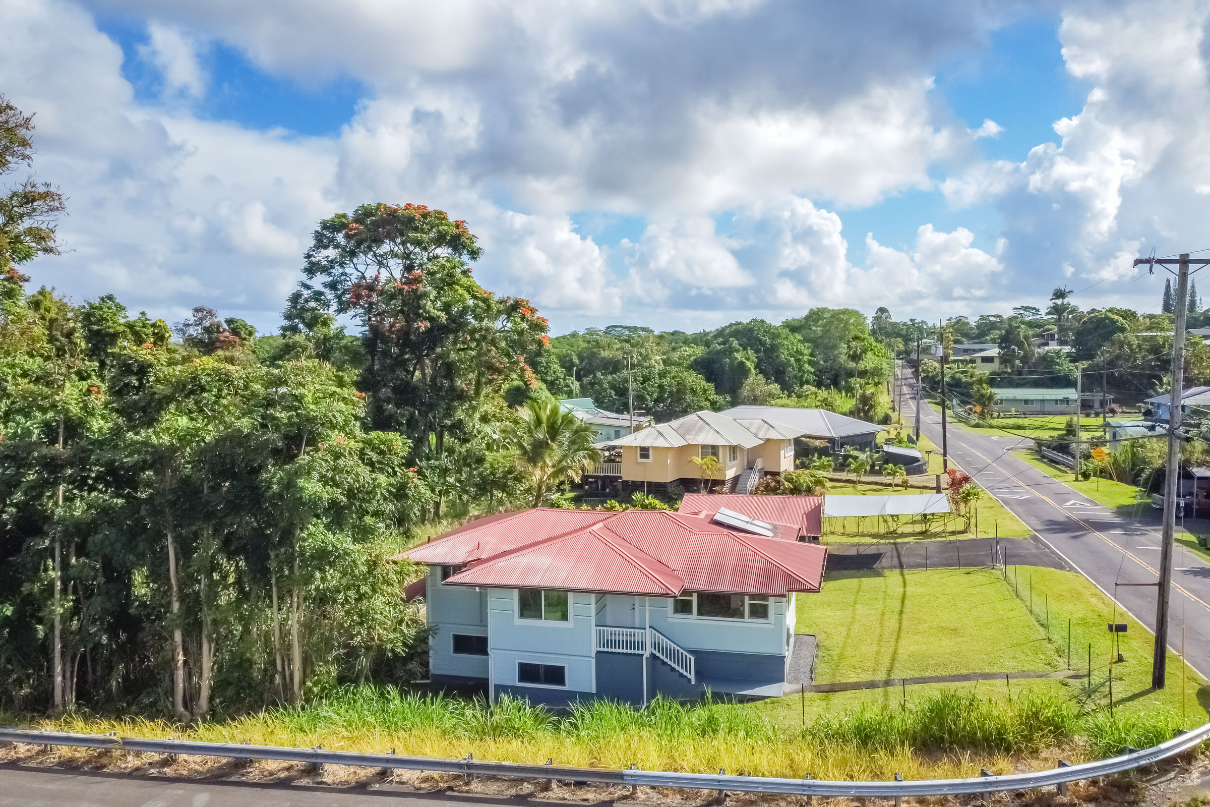 75 East Palai Street Hilo, HI 96720 - Photo 17 of 29 a view of a swimming pool with a garden