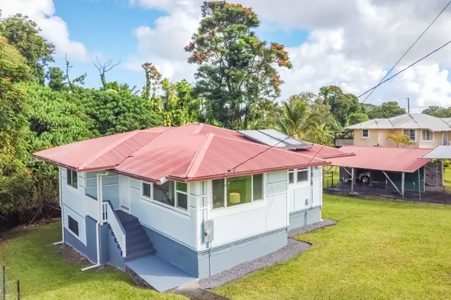 a view of a house with a yard patio and deck