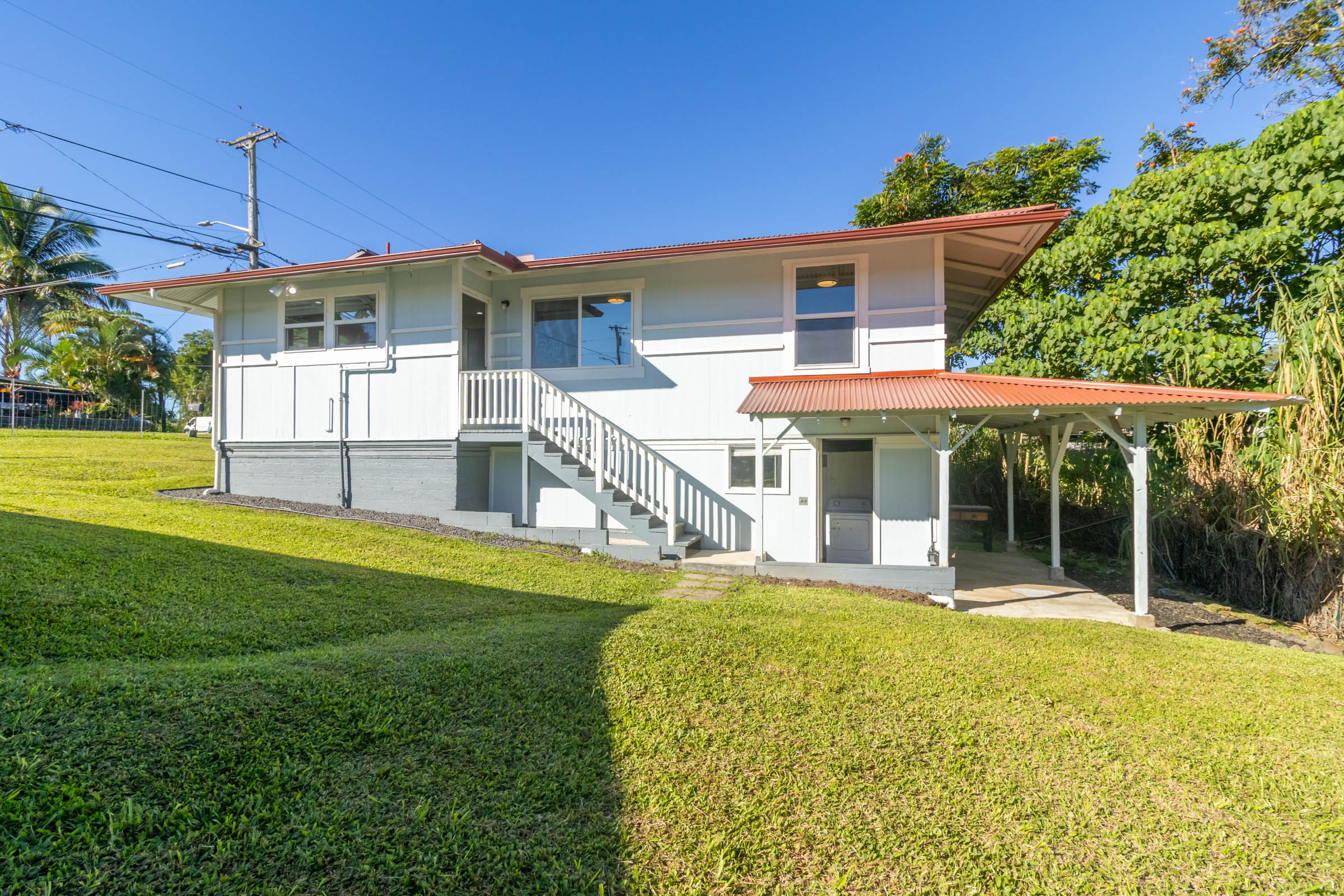 75 East Palai Street Hilo, HI 96720 - Photo 26 of 29 a view of a house with a yard patio and a garden