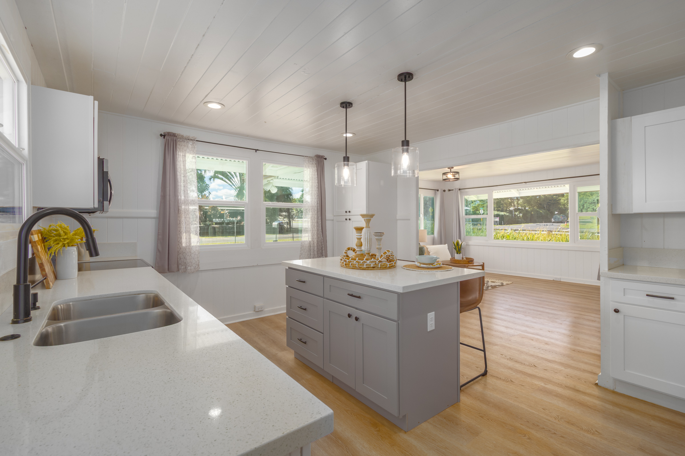 75 East Palai Street Hilo, HI 96720 - Photo 3 of 29 a kitchen with a stove a sink a counter space and a window
