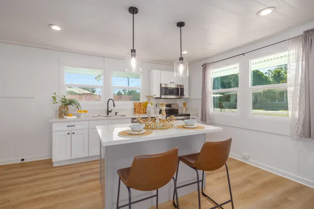 a view of a dining room with furniture window and outside view