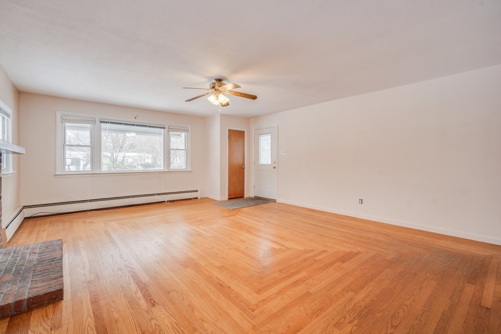 85 Dupuis Road Holyoke, MA 01040 - Photo 8 of 33 wooden floor in an empty room with a window