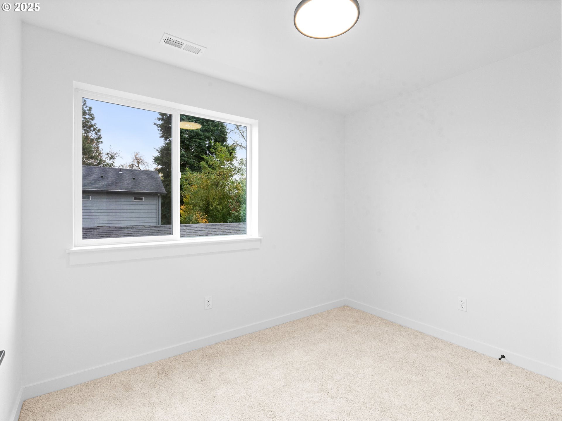 8420 Southeast Clay Street Portland, OR 97216 - Photo 12 of 16 a view of empty room with window