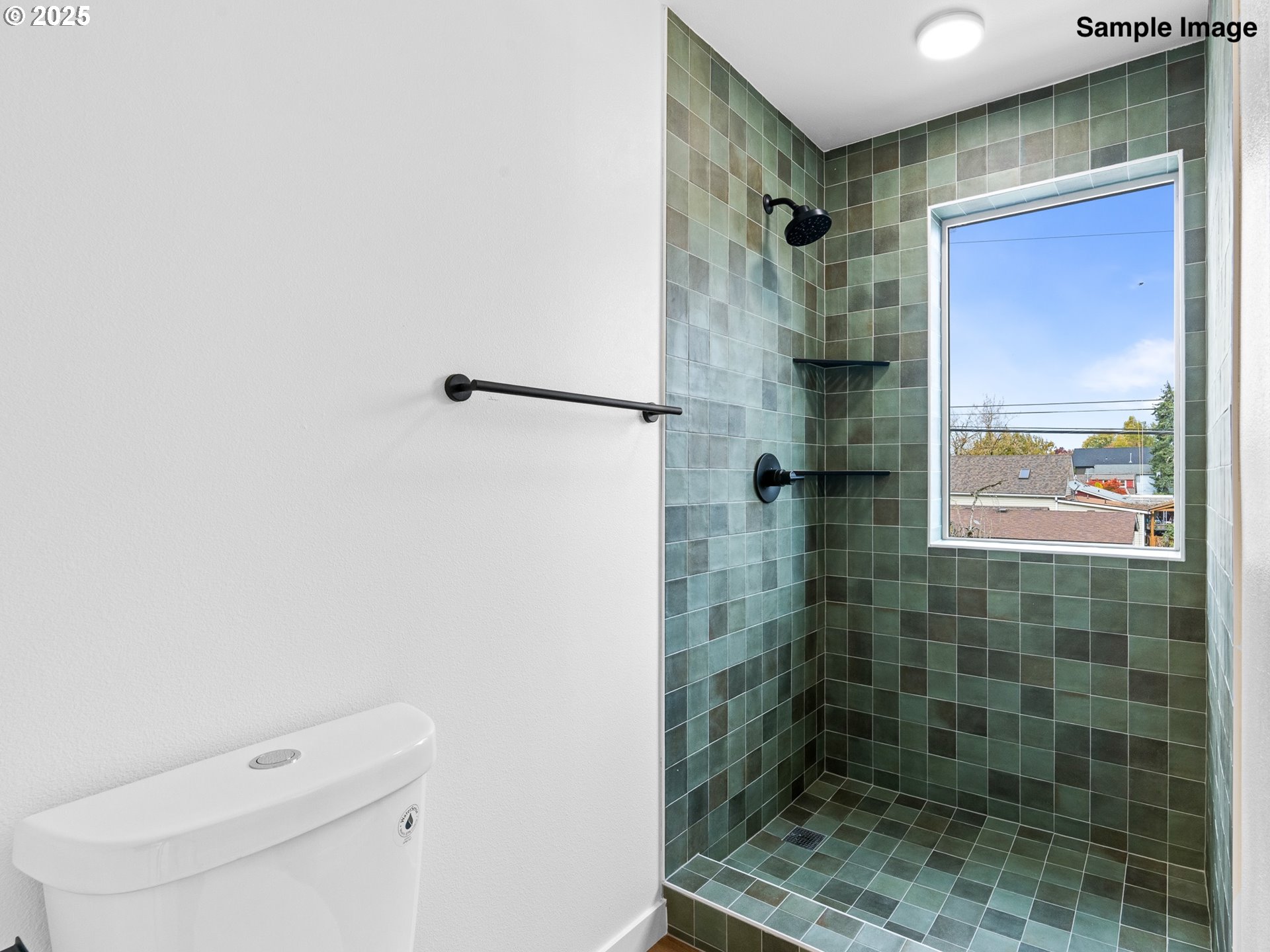8420 Southeast Clay Street Portland, OR 97216 - Photo 14 of 16 a bathroom with a shower a toilet and sink