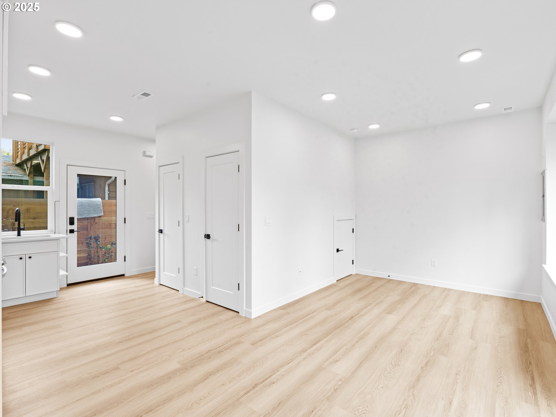 8420 Southeast Clay Street Portland, OR 97216 - Photo 5 of 16 a view of empty room with wooden floor