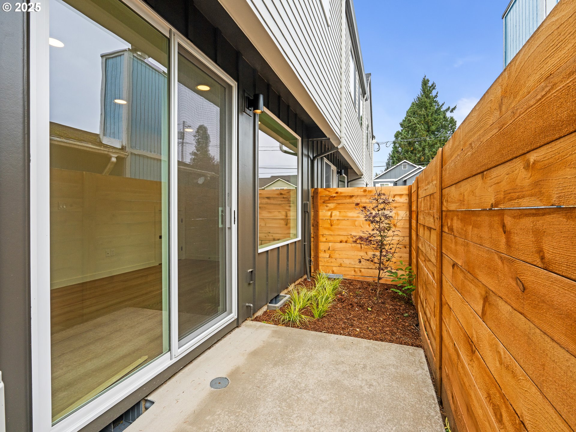 8420 Southeast Clay Street Portland, OR 97216 - Photo 9 of 16 a view of a door and wooden floor in front of a building