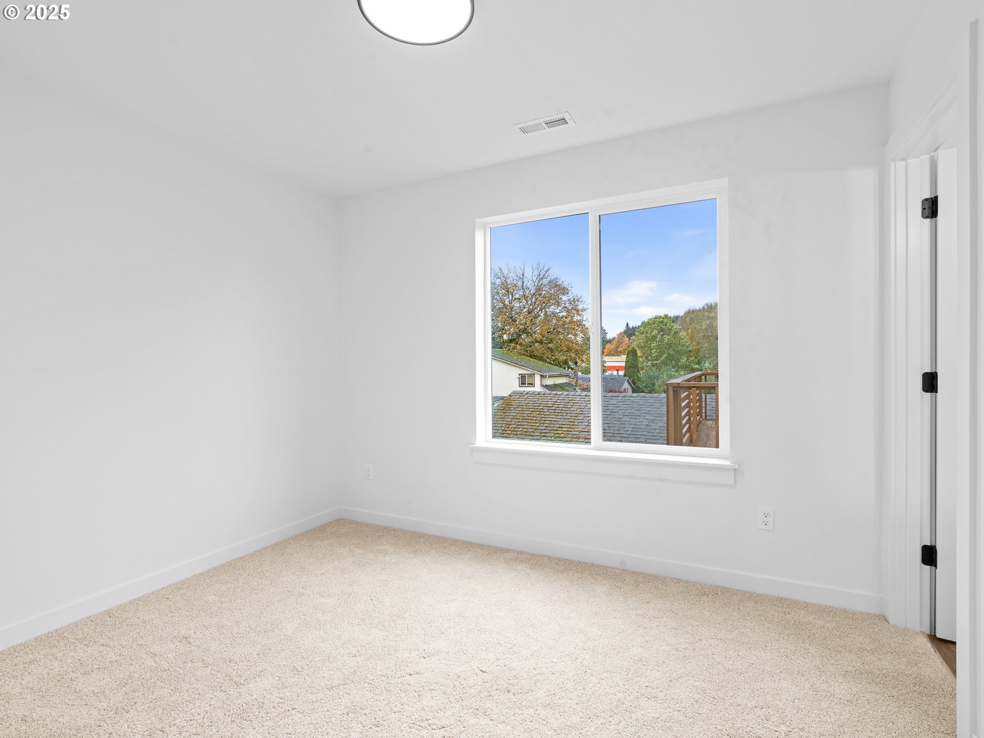 8420 Southeast Clay Street Portland, OR 97216 - Photo 10 of 16 an empty room with a window