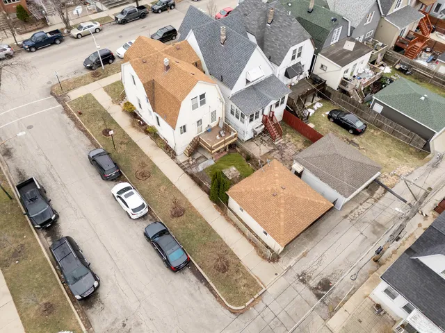 an aerial view of a residential apartment building with a yard