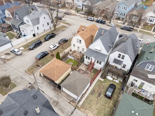 an aerial view of residential building with yard