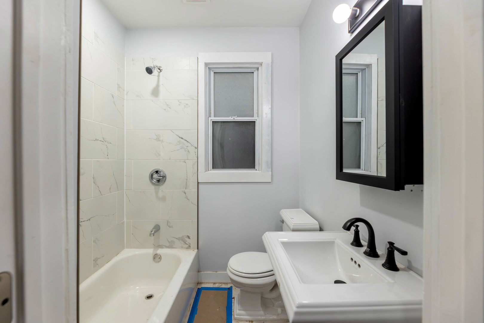 2834 West 36th Street Chicago, IL 60632 - Photo 10 of 24 a bathroom with a sink and a bathtub