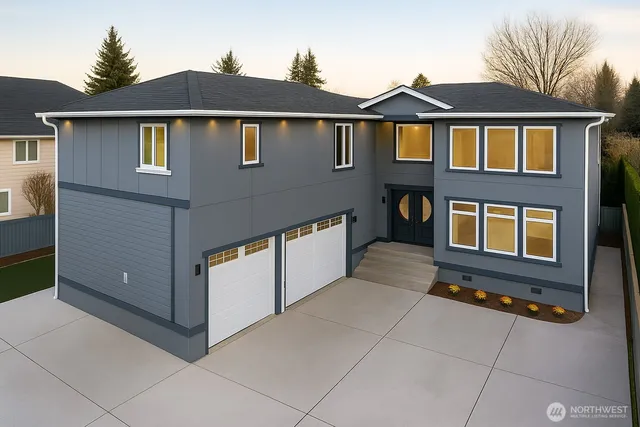 a front view of a house with many windows