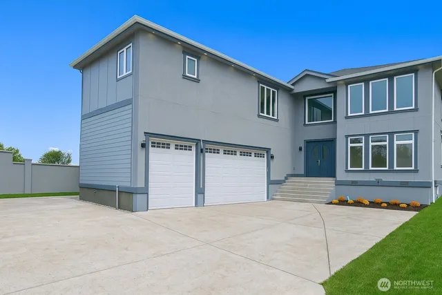 a front view of a house with garage