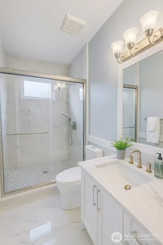 a view of a kitchen with electric appliances
