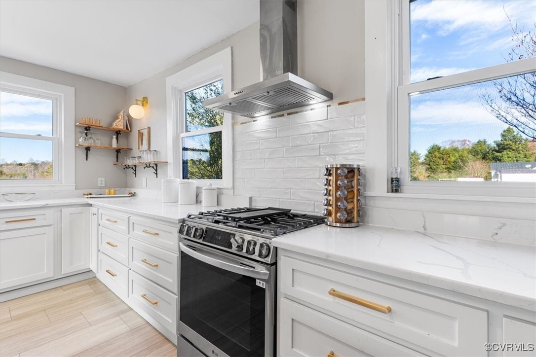 21 Old 15 Road New Canton, VA 23123 - Photo 15 of 49 Kitchen with white cabinets, gas stove, a wealth o