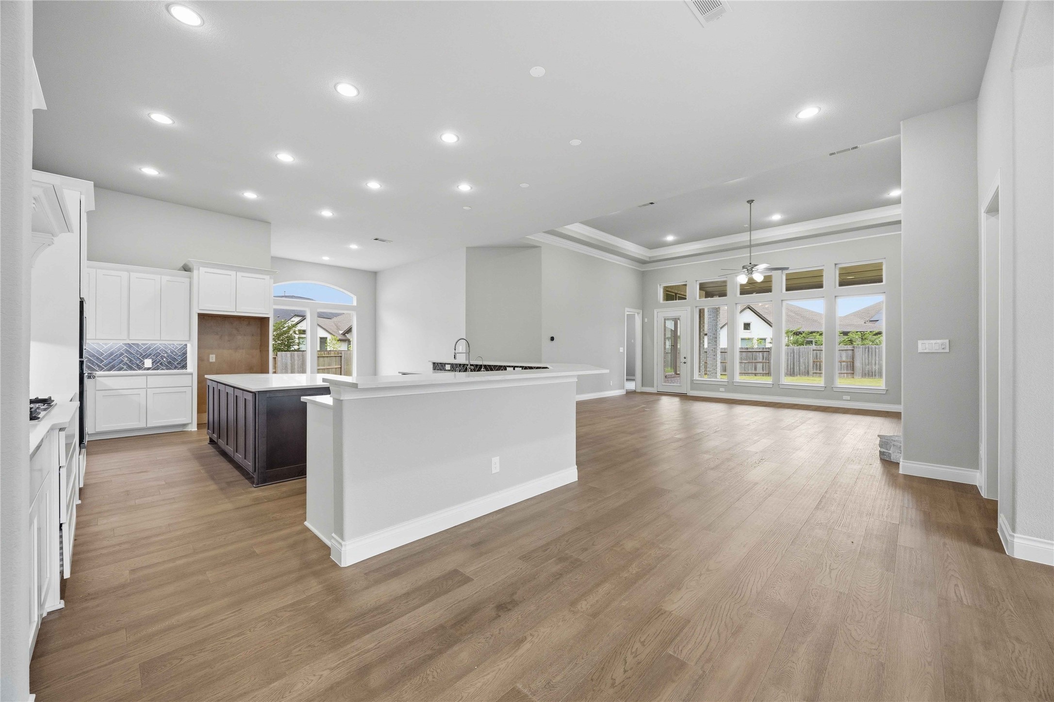 17564 Watercolor Way Conroe, TX 77302 - Photo 12 of 42 Chef's kitchen with quartz counter tops, stylish backsplash, expansive island, stainless steel appliances and walk in pantry