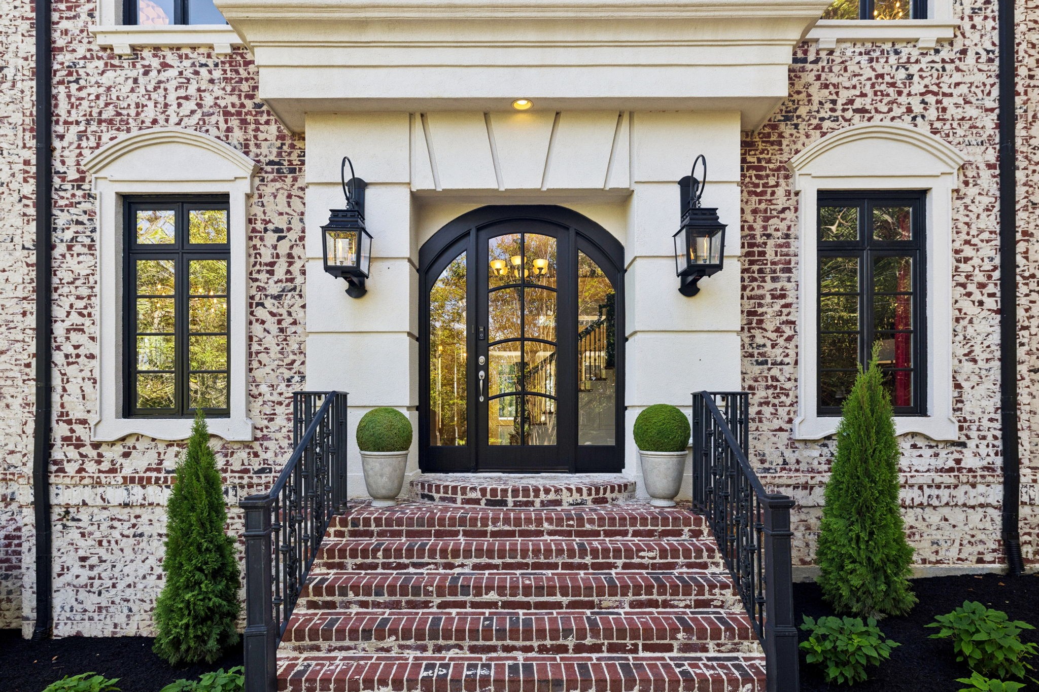 a front view of a house with garden