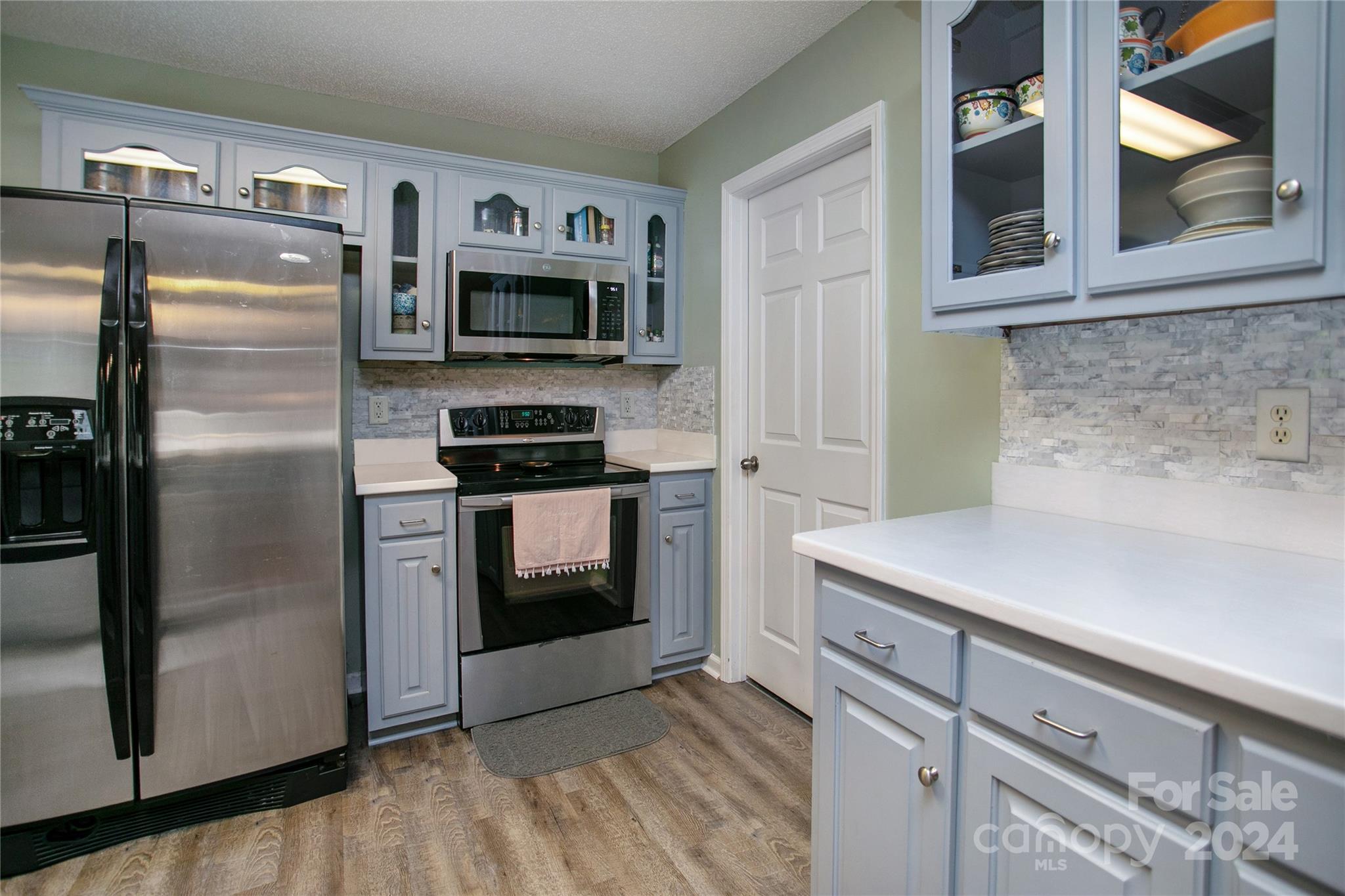 313 Unity Church Road Kings Mountain, NC 28086 - Photo 5 of 24 a kitchen with stainless steel appliances and chandelier