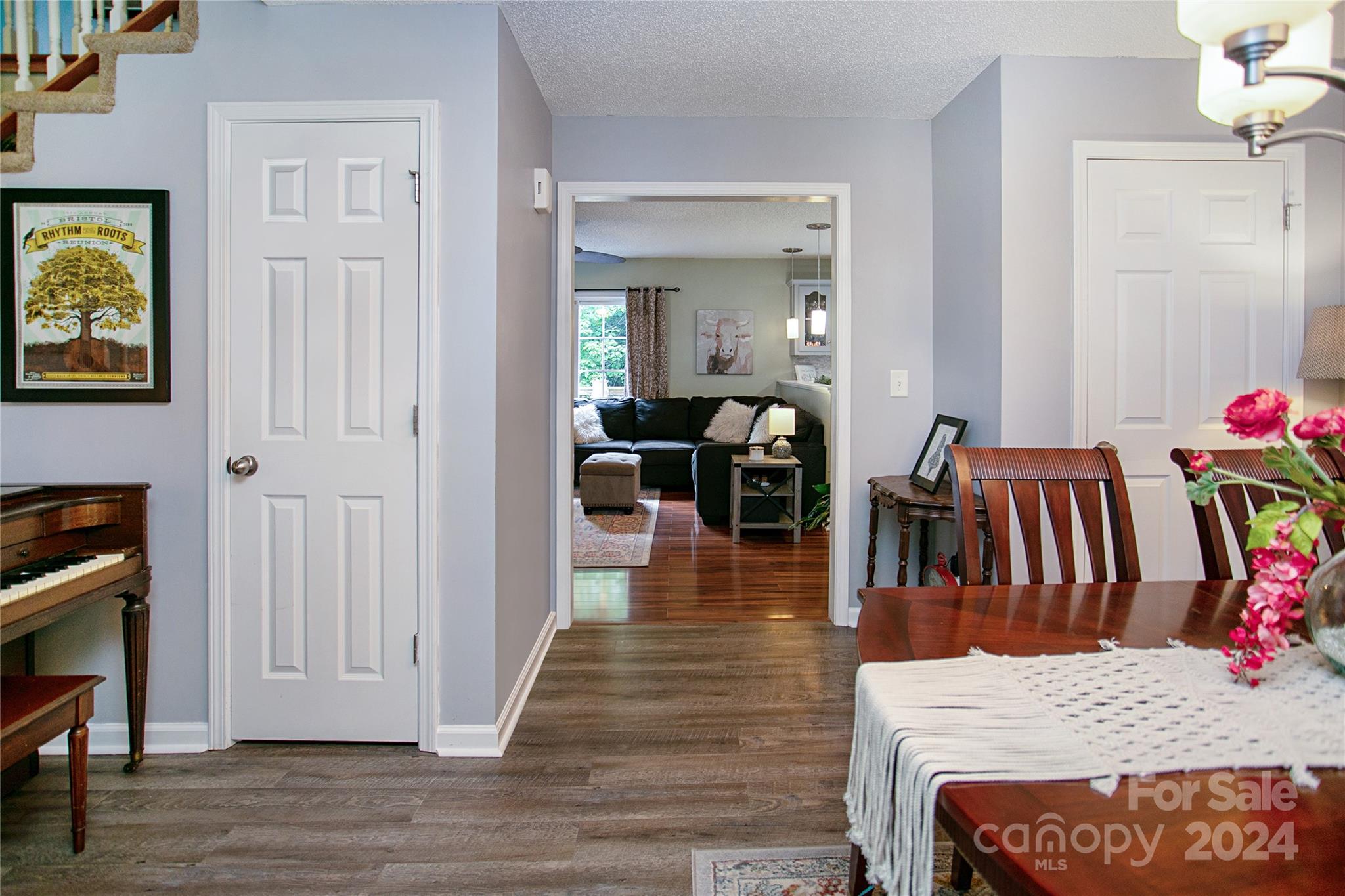 313 Unity Church Road Kings Mountain, NC 28086 - Photo 10 of 24 a view of a dining room and livingroom with furniture wooden floor a rug and a chandelier