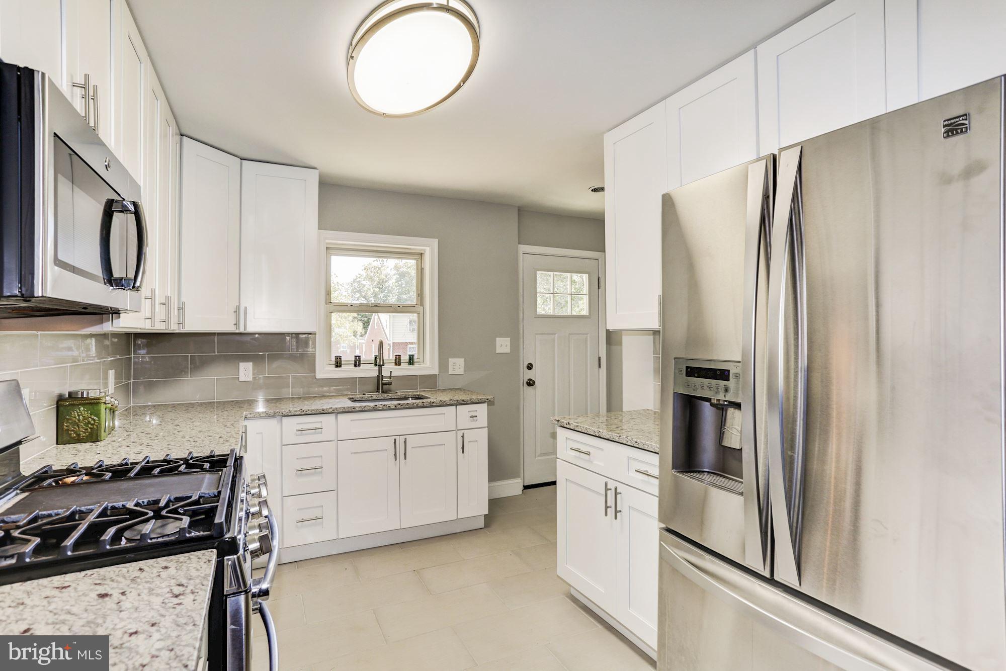 Kitchen with access to rear yard