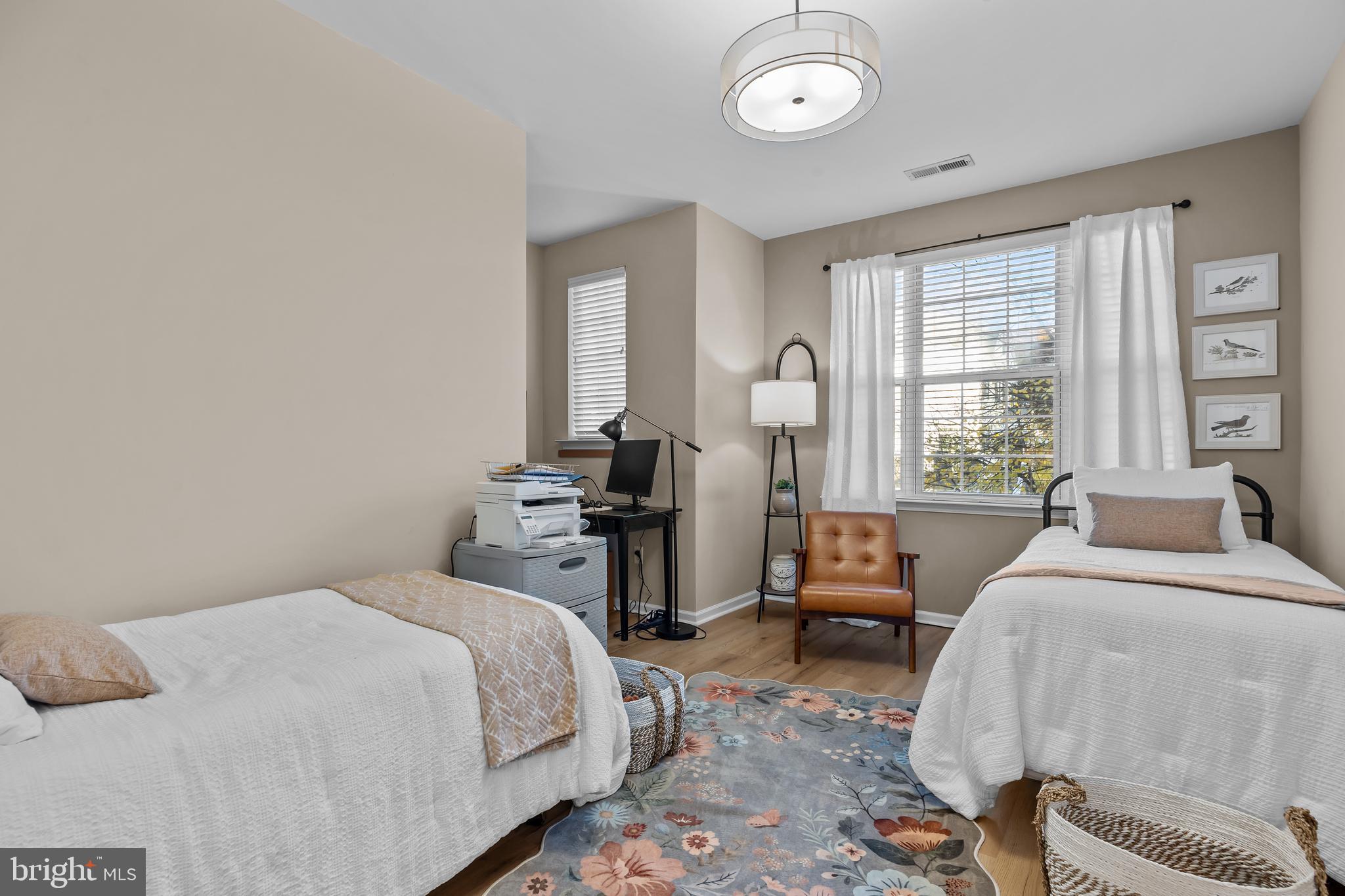 265 Covenant Lane, Unit 8 Harleysville, PA 19438 - Photo 16 of 21 a bedroom with a bed and a chandelier