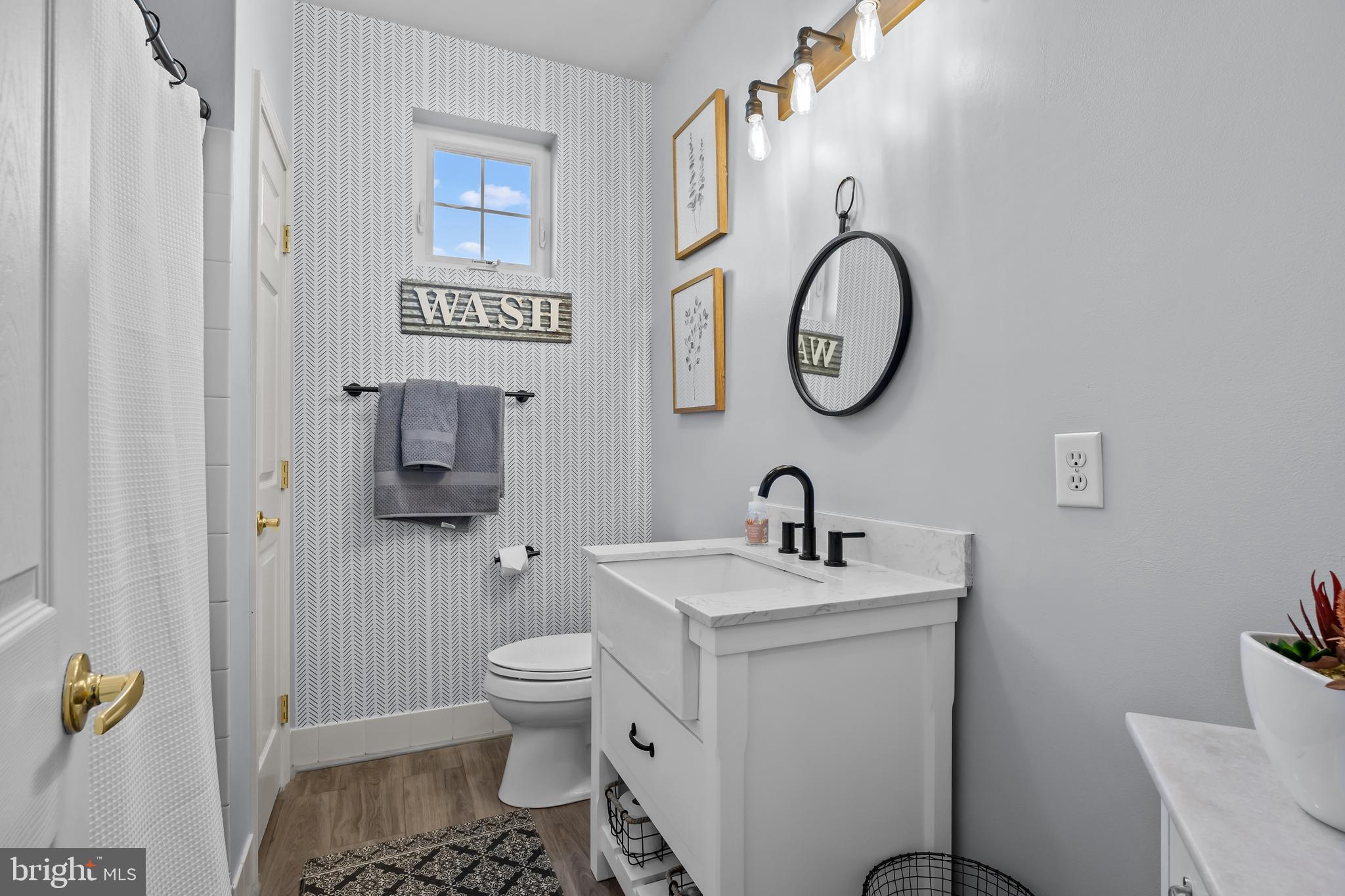 265 Covenant Lane, Unit 8 Harleysville, PA 19438 - Photo 17 of 21 a bathroom with a toilet sink and mirror