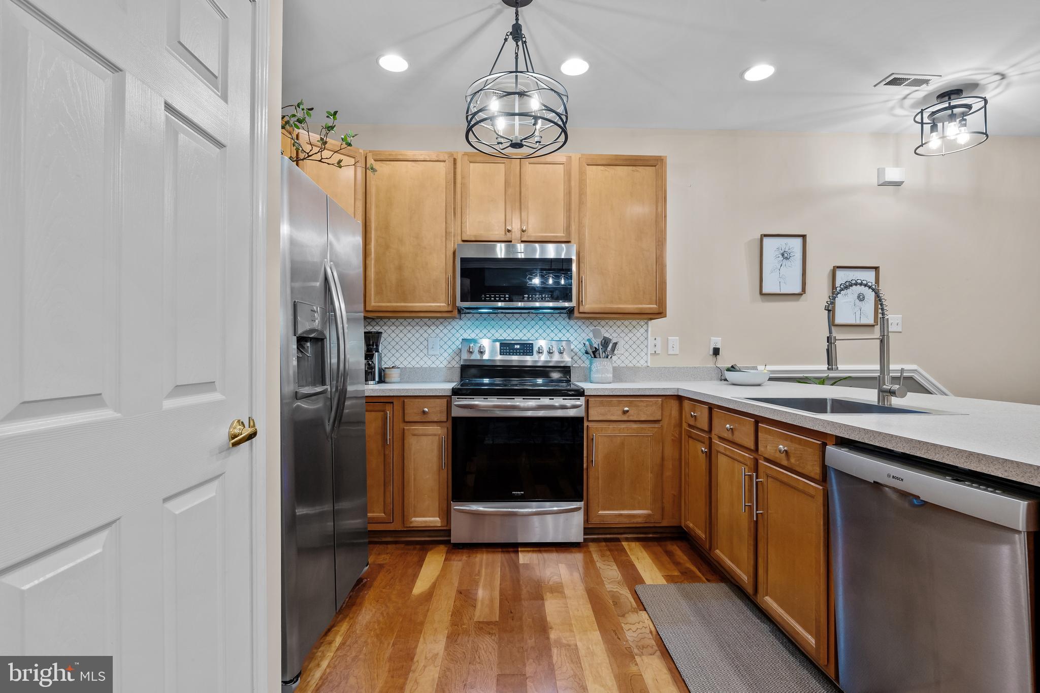 265 Covenant Lane, Unit 8 Harleysville, PA 19438 - Photo 7 of 21 a kitchen with a sink and a stove top oven