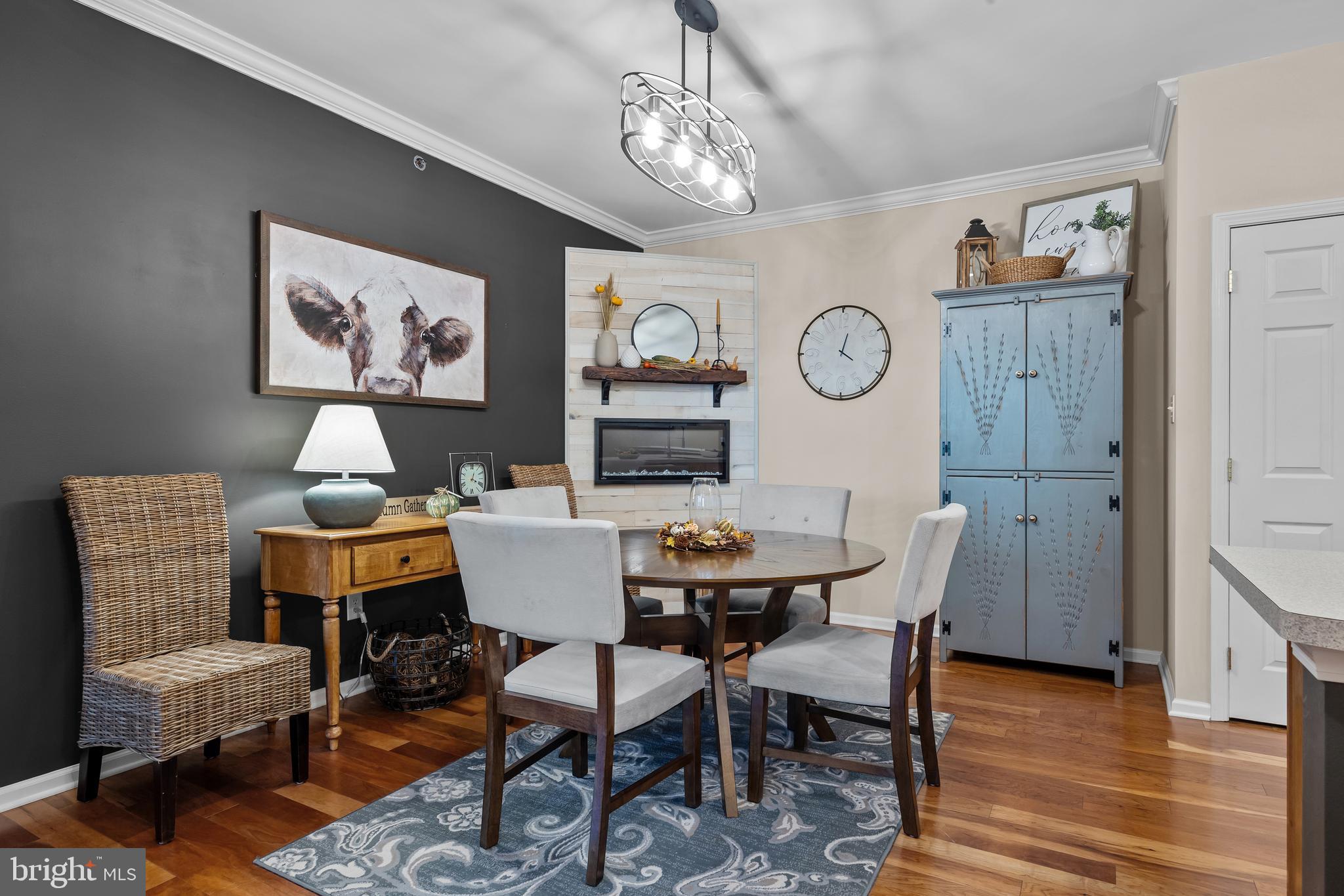 265 Covenant Lane, Unit 8 Harleysville, PA 19438 - Photo 8 of 21 a view of a dining room with furniture wooden floor and a chandelier