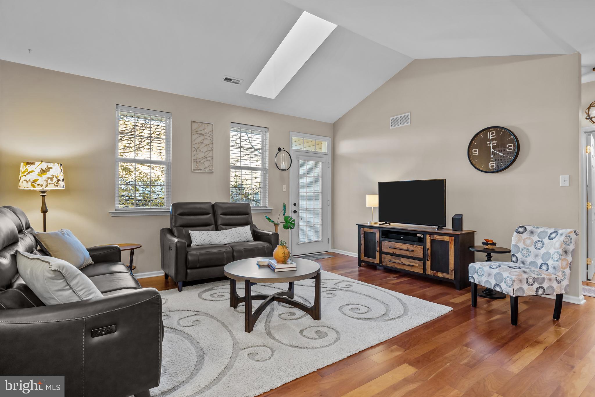 265 Covenant Lane, Unit 8 Harleysville, PA 19438 - Photo 9 of 21 a living room with furniture a flat screen tv and a window
