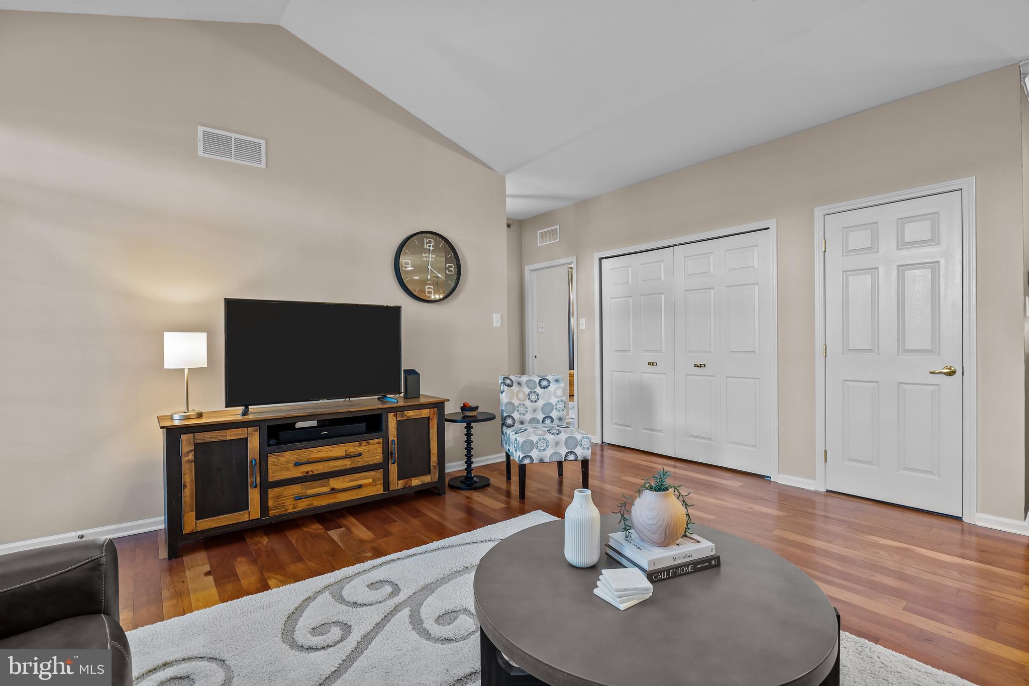 265 Covenant Lane, Unit 8 Harleysville, PA 19438 - Photo 10 of 21 a living room with furniture and a flat screen tv
