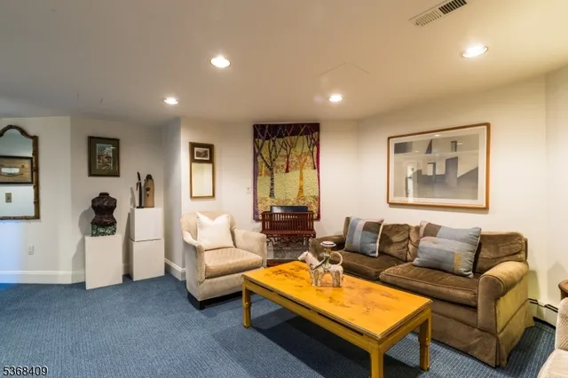 a living room with furniture a table and a window