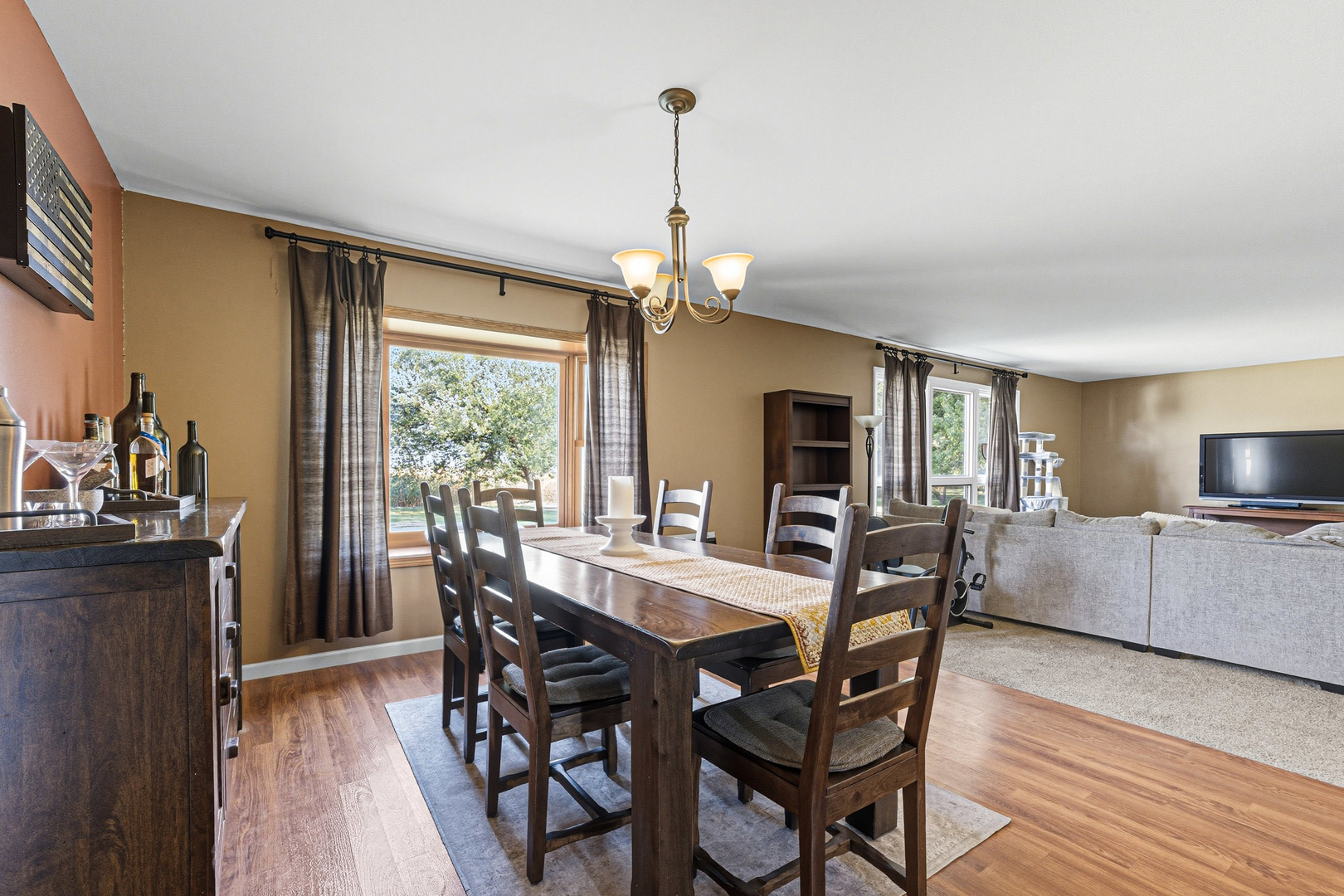 21182 Virginia Road DeKalb, IL 60115 - Photo 12 of 44 a view of a dining room with furniture window and wooden floor