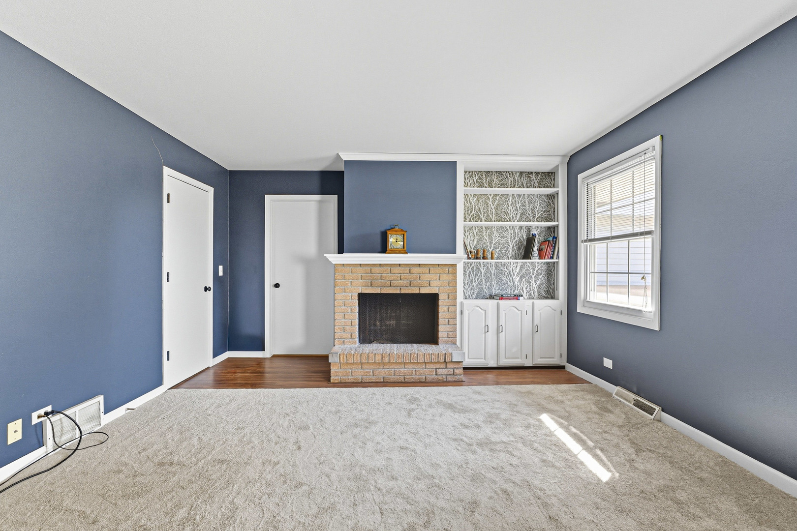 21182 Virginia Road DeKalb, IL 60115 - Photo 14 of 44 an empty room with windows and fireplace
