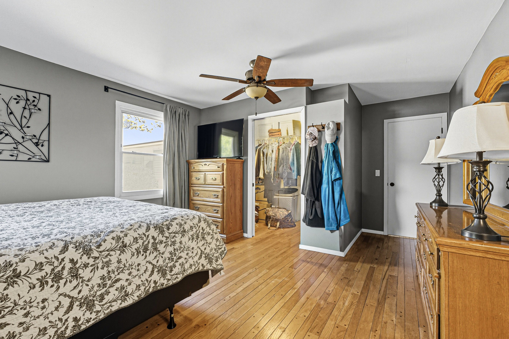 21182 Virginia Road DeKalb, IL 60115 - Photo 21 of 44 a bedroom with a bed and a walk in closet