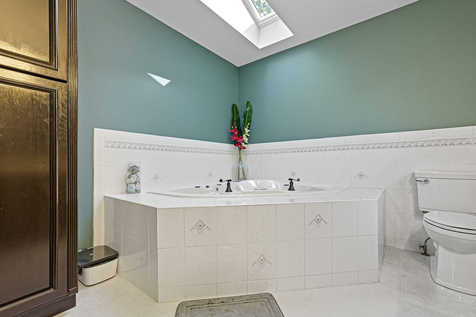 21182 Virginia Road DeKalb, IL 60115 - Photo 23 of 44 a bathroom with a sink and a mirror