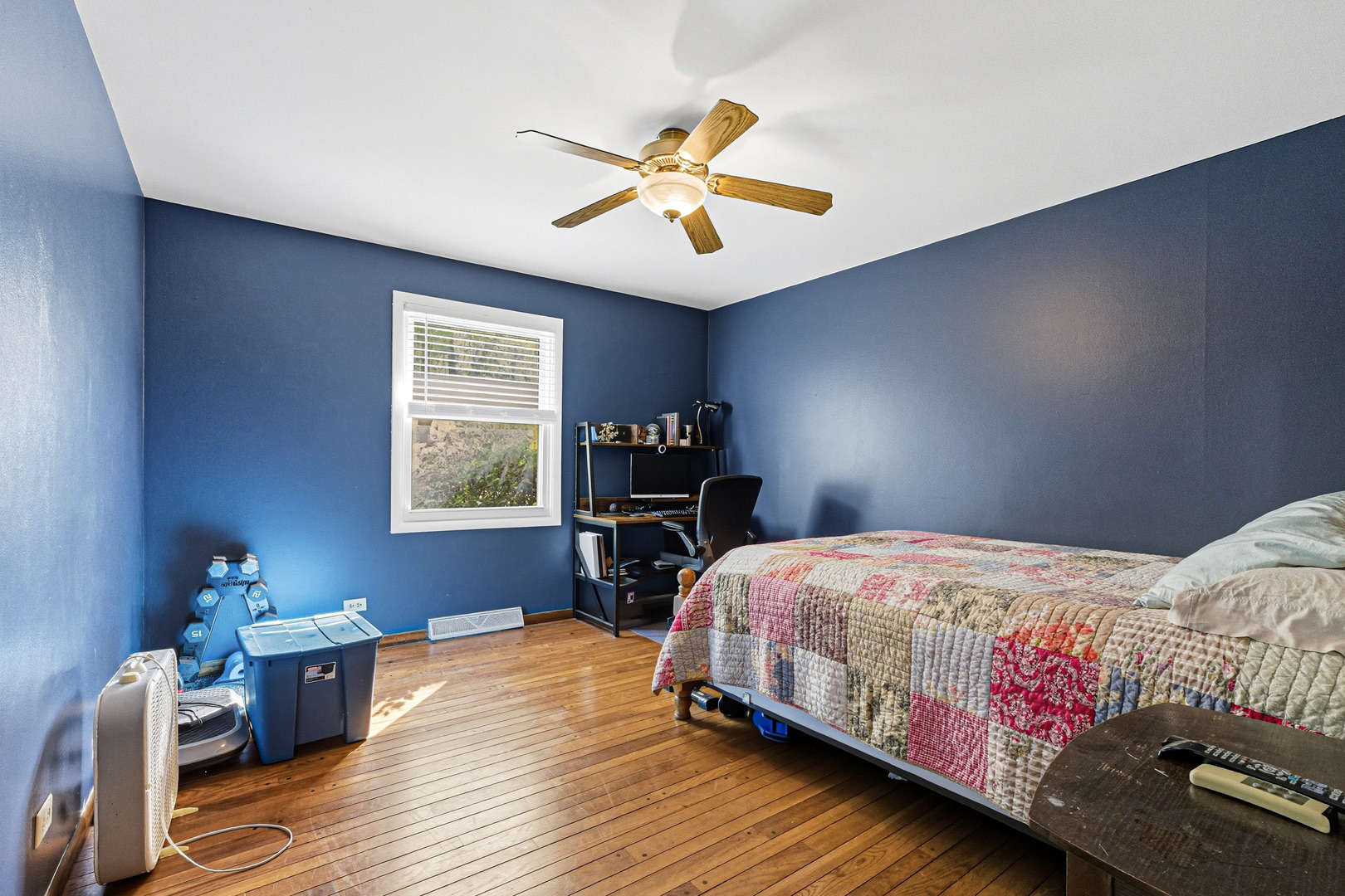 21182 Virginia Road DeKalb, IL 60115 - Photo 25 of 44 a bedroom with a bed and wooden floor