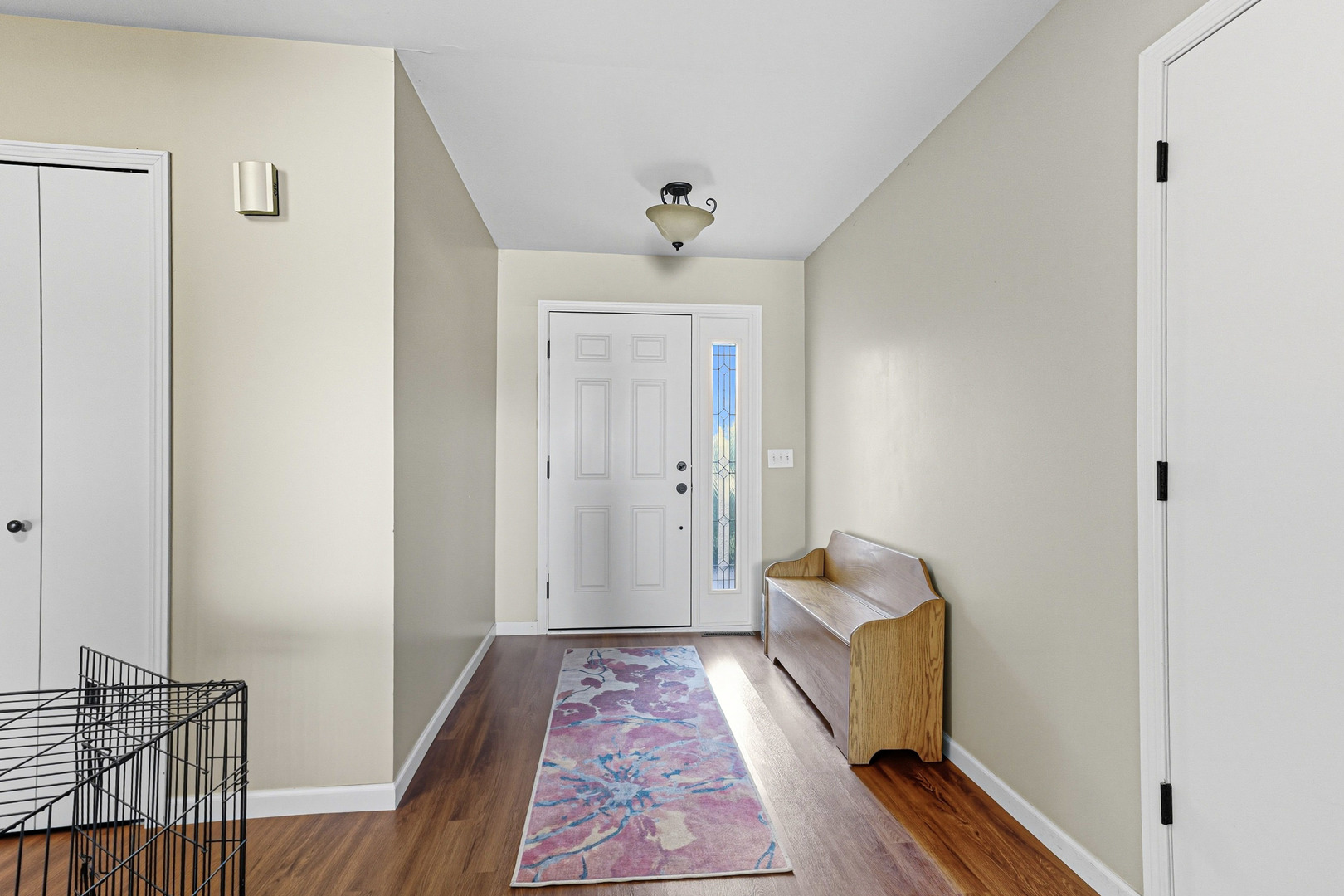 21182 Virginia Road DeKalb, IL 60115 - Photo 3 of 44 a hallway with front door wooden floor and closet