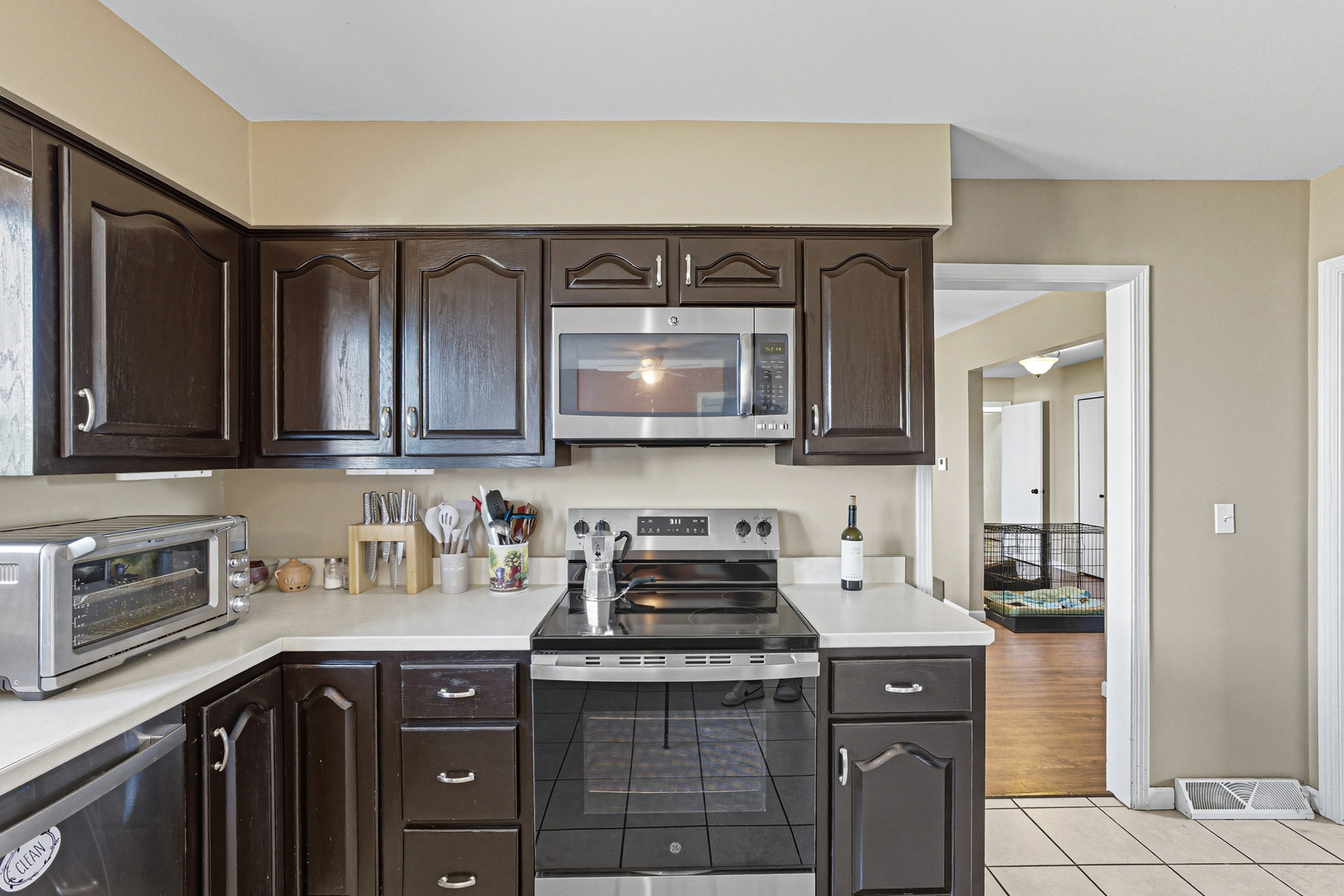 21182 Virginia Road DeKalb, IL 60115 - Photo 6 of 44 a kitchen with stainless steel appliances granite countertop a sink stove and cabinets