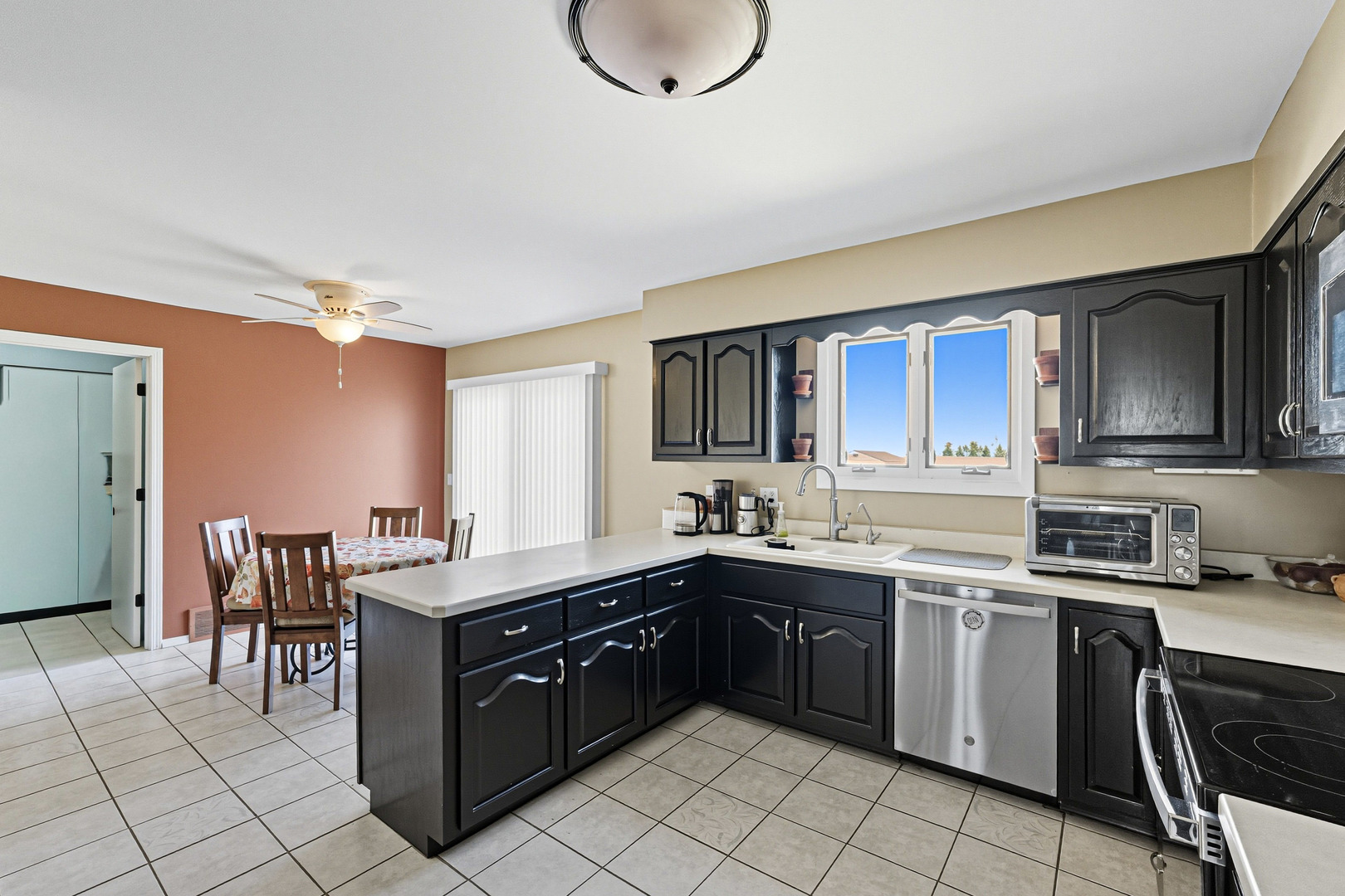 21182 Virginia Road DeKalb, IL 60115 - Photo 8 of 44 a kitchen with a sink counter top space appliances and cabinets