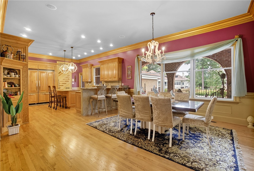 2328 Spindrift Road Virginia Beach, VA 23451 - Photo 8 of 50 Dining area with a chandelier, ornamental molding, light wood-type flooring, and recessed lighting