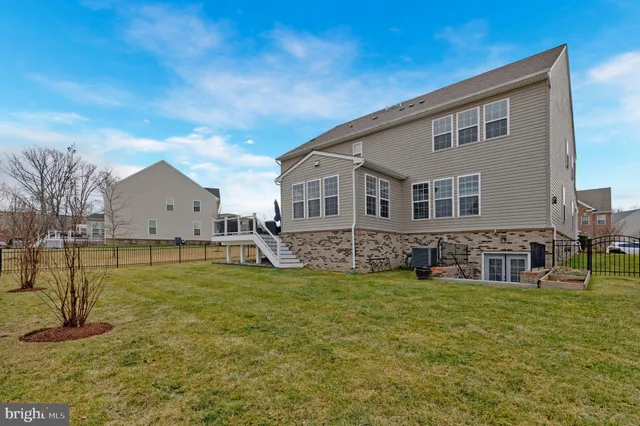 a house view with a sitting space and garden
