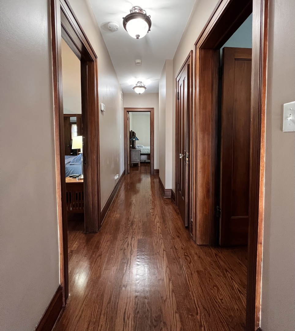 6849 Riverside Drive Berwyn, IL 60402 - Photo 15 of 33 a view of a hallway with wooden floor