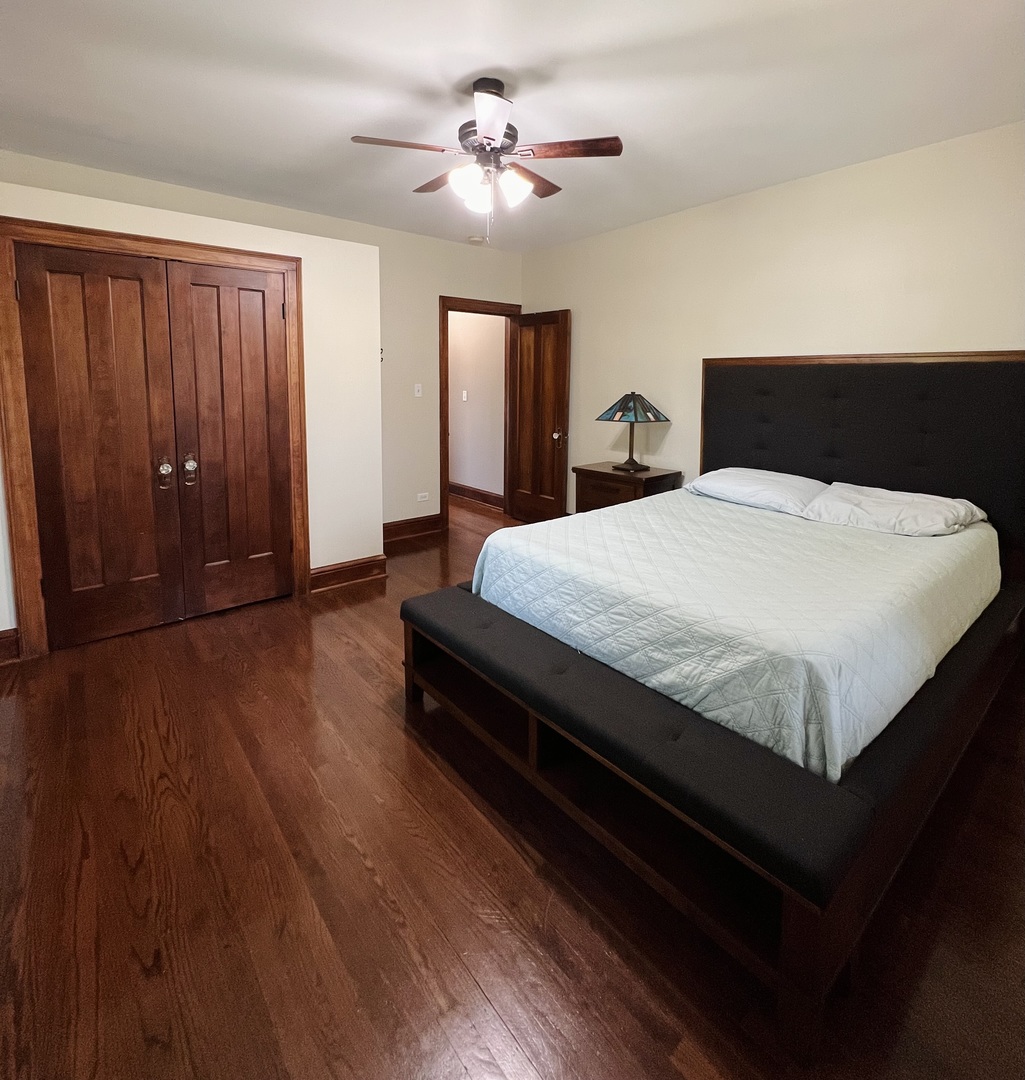 6849 Riverside Drive Berwyn, IL 60402 - Photo 19 of 33 a bedroom with bed and wooden floor